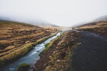 river in the foggy mountains