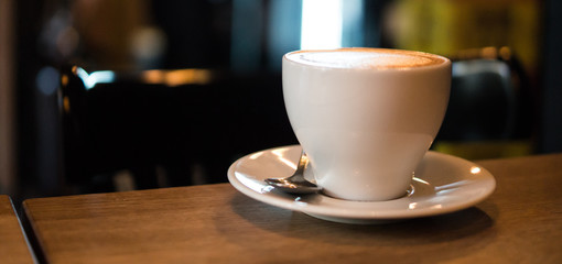 Coffee cup on a wooden table