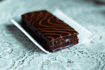 Chocolate cake on a white piece of paper.