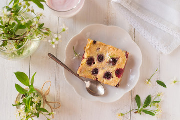 Cherry clafoutis pieces on wooden table