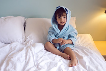 baby boy two years old in a blue Terry robe