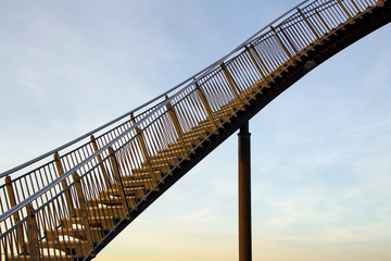 Career steps - a steep upward flight of stairs in front of the afternoon sky