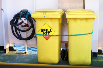 Spill kit yellow wheelie bin for health and safety of chemical, oil, diesel or petrol leak - obrazy, fototapety, plakaty