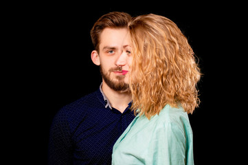 portrait photo of a sexy young couple man and woman in one face, on black background