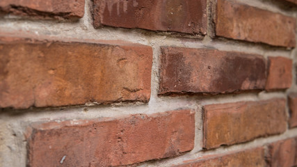 Fototapeta premium Background/Wallpaper/Textures - Orange and yellow bricks in a brick wall.