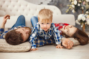 Happy family with child boy are playing in jeans 