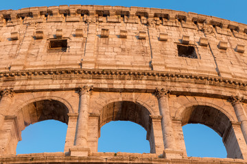 Closeup front view of the three arcs of Colosseum. Rome Italy.