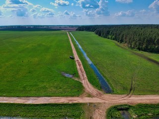 Aerial view of green field  in Minsk Region of Belarus