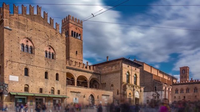Bologna, Italy, Emilia-Romagna. Time lapse of the Palazzo Re Enzo on the Neptune square with beautiful cloudy sky and crowd of people. Zoom effect