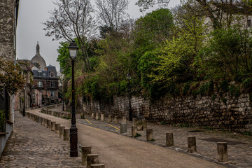 Paris / France. View of the famous street, Rue de l'Abreuvoir, known for its charming and historic architecture, in the Montmartre neighborhood.