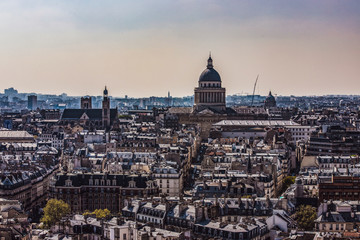 Fototapeta na wymiar Paris, France. The Pantheon and the Latin Quarter from Notre Dame viewpoint. Dome and Saint Etienne du Mont Church.