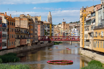Girona river and bridge with people crossing