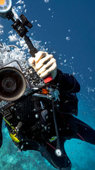An underwater photographer close-up in Tubbataha. The Tubbataha Reef Marine Park is UNESCO World Heritage Site in the middle of Sulu Sea, Philippines.