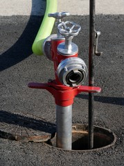 Hydrant mit Hahn und Schlauch