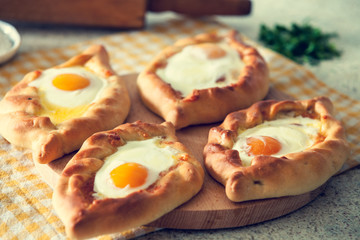 Khachapuri in Adjara with the egg. The Georgian cuisine.