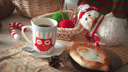 Khachapuri in Adjara with the egg. The Georgian cuisine. Christmas winter