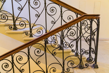 Fototapeta na wymiar steps with handrails, forged staircase indoors
