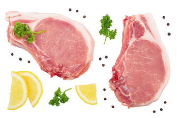 sliced raw pork meat with parsley and lemon isolated on white background. Top view. Flat lay