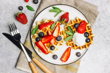 Traditional belgian waffles with fresh berries