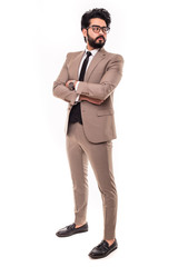 Full length shot of a happy handsome young egypt businessman wearing suit and black tie, isolated on white background