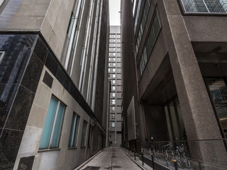 Fototapeta premium Dead end street at the bottom of skyscrapers in downtown Toronto, ontario, Canada, in the CBD. Toronto is a major north American economy hub