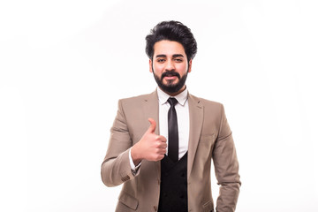 Arab handsome young businessman with hand in pocket smiling and thumbs up, isolated on white background