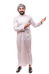 Young arab man pointed side wearing in traditional abaya clothes isolated on white background