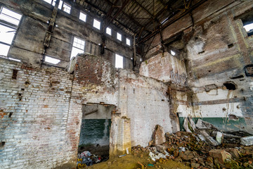 Inside ruined factory. Old industrial building for demolition.