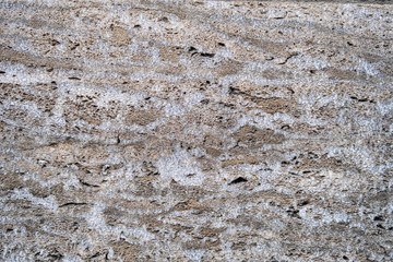 Rocky surface with scratches, markings, lines, blazes, staines and cracks