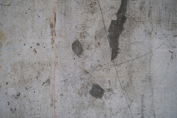 Concrete surface with scratches, markings, lines, blazes, staines and cracks