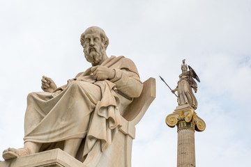 Fototapeta premium Statue of Plato and goddess Athena against cloudy sky, Athens, Greece