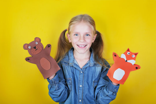 Little Girl Playing In The Theater With Hand Puppet