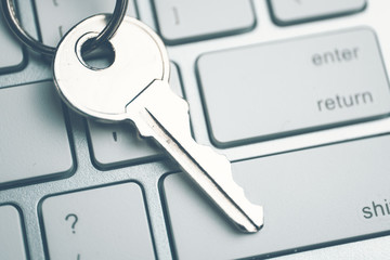 The concept of a strong password from the system. The key on the white keyboard. Toned