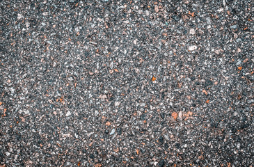 Texture of light smooth asphalt with small stones. Wallpaper for design, top view.
