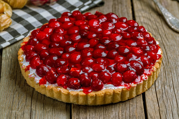 Cherry pie on wooden background