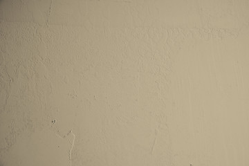 Beige Pastelfarben mit groben Strukturen verputzte Betonwand im Industrial Design. Gestalterisches Element in Pastellfarben als Hintergrund und für Kunstvolle Kollagen. Strukturwand als Tapete und Kun