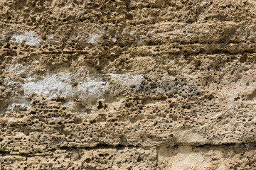 Rough, textured rock surface.