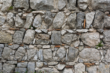 Old Stone wall. Ancient masonry.