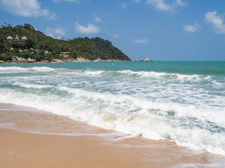beach with waves in island of Ko Phangan, Thailand