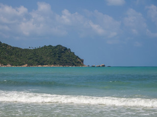 Fototapeta na wymiar beach with waves in island of Ko Phangan, Thailand