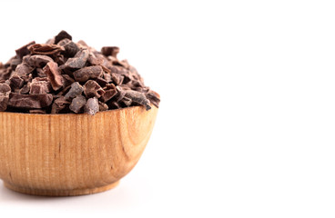 Bowl of Chocolate Nibs Isolated on a White Background