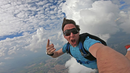 Parachutist doing a selfie in a wonderful sky