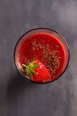 Chocolate strawberry smoothie with berries. Healthy drink. View from above, top studio shot