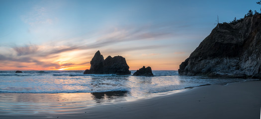 View of Large Cliff and Rocks in the Oregon Shore During Sunset