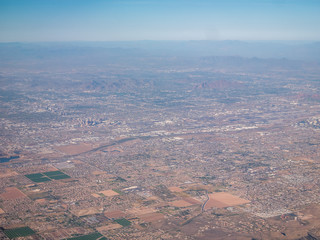 Fototapeta na wymiar View of Downtown Phoenix from the Skies With Mountains in the background
