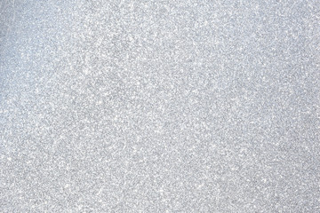 sparkles of silver glitter abstract background