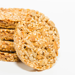 Healthy diet snack close-up. Cereal cookies with nuts isolated on a white background. 