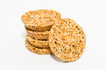 Healthy diet snack close-up. Cereal cookies with nuts isolated on a white background. 