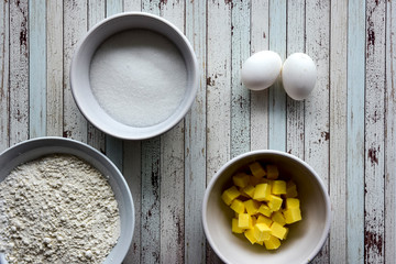 Steps of cooking a gluten free coconut and caramel pie on a wooden background