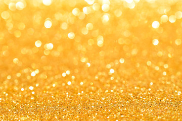 sparkles of golden glitter abstract background	